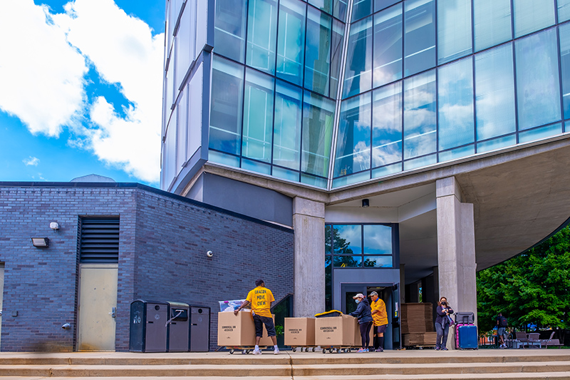 Crews from University and Student Services (USS) move student belongings into Millennium Hall on Sept. 10. Photo by Jeff Fusco.